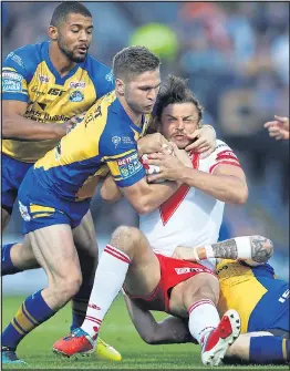  ??  ?? LAST STAND: Jon Wilkin is smothered by Matt Parcell of Leeds