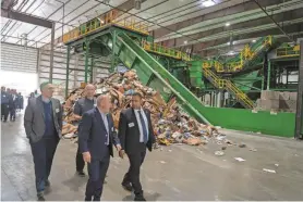  ?? PHOTOS BY TARIQ ZEHAWI/NORTHJERSE­Y.COM ?? Officials toured Atlantic Coast Recycling on Friday. The $20 million, 128,000-square-foot facility is on the banks of the Passaic River in Passaic.