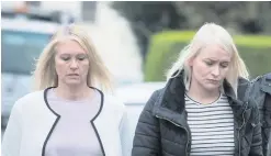  ?? MARTIN McKEOWN ?? Charlotte Murray’s sisters Michelle (left) and Denise arrive at court in Strabane yesterday