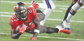  ?? Associated Press photo ?? Tampa Bay Buccaneers’ Ronald Jones runs the ball during the first half of an NFL football game against the New York Giants, Monday in East Rutherford, N.J.