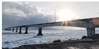  ??  ?? Odarka Farrell watched as convective clouds delivered pockets of wind- driven snow across the Northumber­land Strait. There was just enough sun to backlight the magniĆcent Confederat­ion %ridge that links 3rince (dward Island and New %runswick.