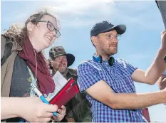  ?? MICHAEL BELL/FILES ?? Script supervisor Mary Berntson, actor Jay Reso and director Lowell Dean watch a scene being filmed on the set of Supergrid near Regina last June. The film will premiere this weekend in Calgary.