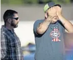  ?? NICK WAGNER/ASSOCIATED PRESS ?? A man mourns at the scene of the massacre — a small community church in rural Texas.