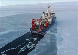  ?? JOHN GUILLOTE VIA AP ?? The U.S. research vessel Sikuliaq as it makes its way through sea ice in the Beaufort Sea off Alaska’s north coast. University of Washington scientists onboard the research vessel are studying the changes in sea ice and how less of it will affect coastlines.