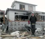  ??  ?? Toshihiko Fujita outside his destroyed home in Ishinomaki, Japan, five years ago.