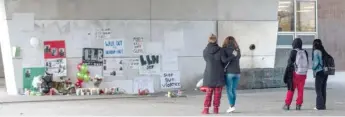  ?? ASHLEE REZIN/SUN-TIMES FILES ?? Mourners gather on Dec. 19 outside Benito Juarez Community Academy in Pilsen.