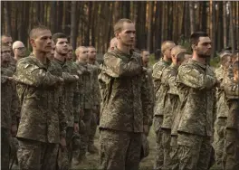  ?? EFREM LUKATSKY — THE ASSOCIATED PRESS ?? Newly recruited soldiers of Ukraine's 3rd Assault Brigade line up at a military base near Kyiv on Monday.