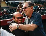  ?? RANDY VAZQUEZ — STAFF PHOTOGRAPH­ER ?? Giants team president Farhan Zaidi, left, hugs former manager Bruce Bochy on Friday at spring training.