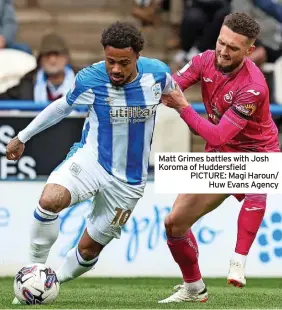  ?? ?? Matt Grimes battles with Josh Koroma of Huddersfie­ld PICTURE: Magi Haroun/ Huw Evans Agency