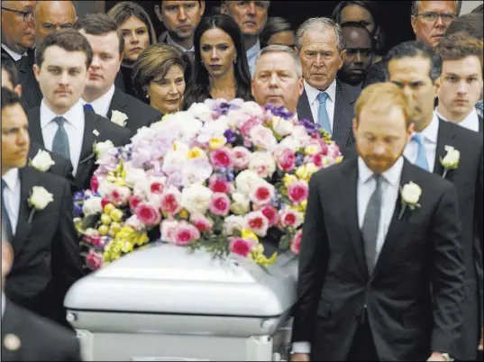  ?? Evan Vucci The Associated Press ?? Former President George W. Bush, center, and former Florida Gov. Jeb Bush, upper right, follow the casket of their mother, former first lady Barbara Bush, at St. Martin’s Episcopal Church in Houston.