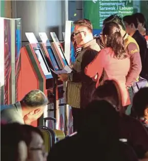  ??  ?? Passengers at Terminal 1 of Kota Kinabalu Internatio­nal Airport. Malaysia Airports Holdings Bhd says total tourist arrivals to Sabah increased 7.5 per cent to 3.7 million last year from 2016.