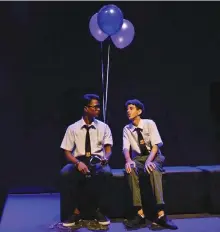  ?? — Photo courtesy of Kenneth Lai ?? Juan Amri as Jacob (left) interactin­g with Chaim, played by Koshigan s/o Guvalakris­nan, as he is visited by the mysterious balloon-bearing character.