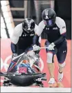  ?? [WONG MAYE-E/THE ASSOCIATED PRESS] ?? Driver Nick Cunningham and Hakeem Abdul-Saboor of the United States start their third heat during the two-man bobsled final on Monday.
