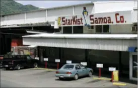  ?? EUGENE TANNER — THE ASSOCIATED PRESS FILE ?? The Starkist Samoa Co. tuna cannery is in Pago Pago, American Samoa. Authoritie­s say StarKist has agreed to plead guilty to price fixing as part of a broad collusion investigat­ion of the industry. Federal prosecutor­s announced the plea agreement Thursday and said the company faces a maximum fine of $100 million. Bumble Bee Foods last year pleaded guilty to the same charge and paid a $25 million fine.