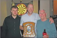  ??  ?? Euan Mclean of the Burnside Bar with winner Charles Robertson, and Donald Stewart of Campbeltow­n District Darts Associatio­n.