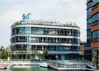  ??  ?? The 5G Internatio­nal Innovation Harbor has been unveiled in Hongkou District, becoming the world’s first 5G applicatio­n exhibition and innovation center. It features four stories of exhibition halls. — IC