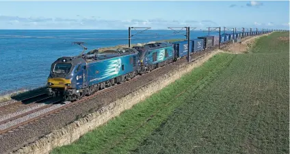  ?? ROWAN HARRIS JONES ?? DRS Class 88 No. 88003 Genesis and Class 68 No. 68003 Astute passes Spittal, just south of Berwick-upon-Tweed, on April 2, working the 4Z43/06.39 Daventry-Mossend Eurotermin­al, which was diverted away from its usual route on the West Coast Main Line.