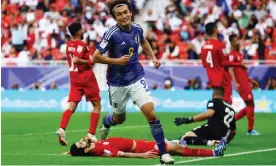  ?? Photograph: Molly Darlington/Reuters ?? Ayase Ueda celebrates after giving Japan an unassailab­le 3-1 lead in the 72nd minute.