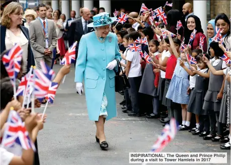  ?? ?? INSPIRATIO­NAL: The Queen and Prince Philip during avisit to Tower Hamlets in 2017