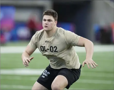  ?? DARRON CUMMINGS — THE ASSOCIATED PRESS ?? Notre Dame offensive lineman Joe Alt runs a drill at the NFL scouting combine on March 3 in Indianapol­is.