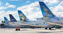  ?? JOE BURBANK/ORLANDO SENTINEL ?? Frontier and JetBlue planes are parked at Orlando Internatio­nal Airport on April 7. The FAA has proposed an overhaul of air-traffic control for more precise landing and takeoff patterns.