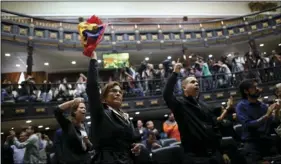  ?? AP PHOTO/ARIANA CUBILLOS ?? Anti-government lawmakers shout “Fraud,” during a session of Venezuela’s National Assembly in Caracas, Venezuela on Wednesday. The National assembly’s claim of a fraudulent election was bolstered when the CEO of the voting technology company Smartmatic...