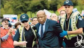  ?? Drew Angerer Getty Images ?? REP. JOHN LEWIS of Georgia was among the Democratic lawmakers arrested at a Washington rally urging the House to take up immigratio­n legislatio­n.