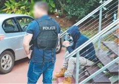  ?? Picture: AFP ?? SEIZURE: A man arrested in the Mareeba area.