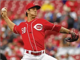  ?? DAVID JABLONSKI/STAFF ?? Michael Lorenzen is one of four pitchers competing for the Reds’ fifth-starter job. If he doesn’t make it, he could move back to the bullpen.