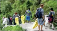  ??  ?? Volunteers amidst a cleanlines­s drive in Dharamsala.