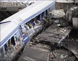  ?? GIANNIS PAPANIKOS — THE ASSOCIATED PRESS ?? Debris of two wrecked trains lie on the rail lines in Larissa, Greece, on Wednesday.