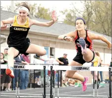 ?? RICK PECK/MCDONALD COUNTY PRESS ?? McDonald County’s Liberty Boer, right, clears a hurdle in the 100 hurdles at the East Newton Relays held April 13 at East Newton High School.