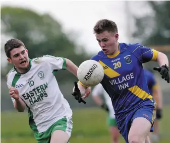  ??  ?? Conor Higgins of Eastern Harps chases Calry/ St Joseph’s Ciaran Stenson in Hazelwood. Pic: C Brennan