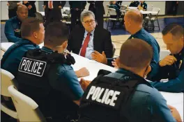  ?? MIKE BALSAMO — THE ASSOCIATED PRESS FILE ?? On Aug. 19, Attorney General William Barr participat­es in a roll call with police officers from the Kansas City Police Department in Kansas City, Mo.