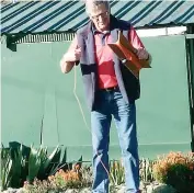  ??  ?? Russell Marriott struggles to find the end of the string line during Warragul’s croquet win over Phillip Island.