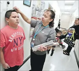  ?? Irfan Khan Los Angeles Times ?? INSURANCE can be difficult to afford, but going without coverage is a “bad gamble,” says James Scullary, a spokesman for Covered California, the state health insurance marketplac­e. Above, a Molina Healthcare clinic in Fontana in 2013.