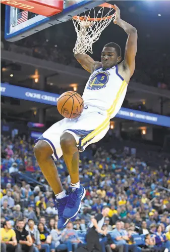  ?? Thearon W. Henderson / Getty Images ?? Kevon Looney, shown dunking in an exhibition game, has started the past two games.