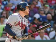  ?? MITCHELL LAYTON / GETTY IMAGES ?? Freddie Freeman led off the Braves’ hitting rampage Saturday with a double in the four-run second inning against the Nationals.