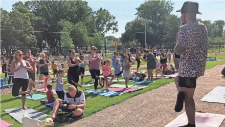  ?? LORI NICKEL / MILWAUKEE JOURNAL SENTINEL ?? Green Bay Packers cornerback Jaire Alexander talks to the children who came out to try goat yoga Friday at the Children’s Museum of Green Bay.