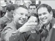  ?? Mary Schwalm Associated Press ?? SEN. MARCO RUBIO, right, takes a photo with fans at a campaign stop in Atkinson, N.H., this week.