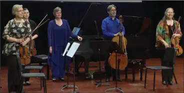  ?? (Special to the Democrat-Gazette) ?? Pianist Linda Holzer (center) joins Arkansas Symphony musicians (from left) Sandy McDonald and Leanne Day-Simpson, violins; Rafael Leon, cello; and Katherine Reynolds, viola, for the Arkansas premiere of Florence Price’s “Piano Quintet No. 2” in a minor, Tuesday at the Clinton Presidenti­al Center in Little Rock.