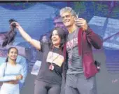  ?? PHOTO: HTCS ?? A participan­t donates her hair on stage with Milind Soman