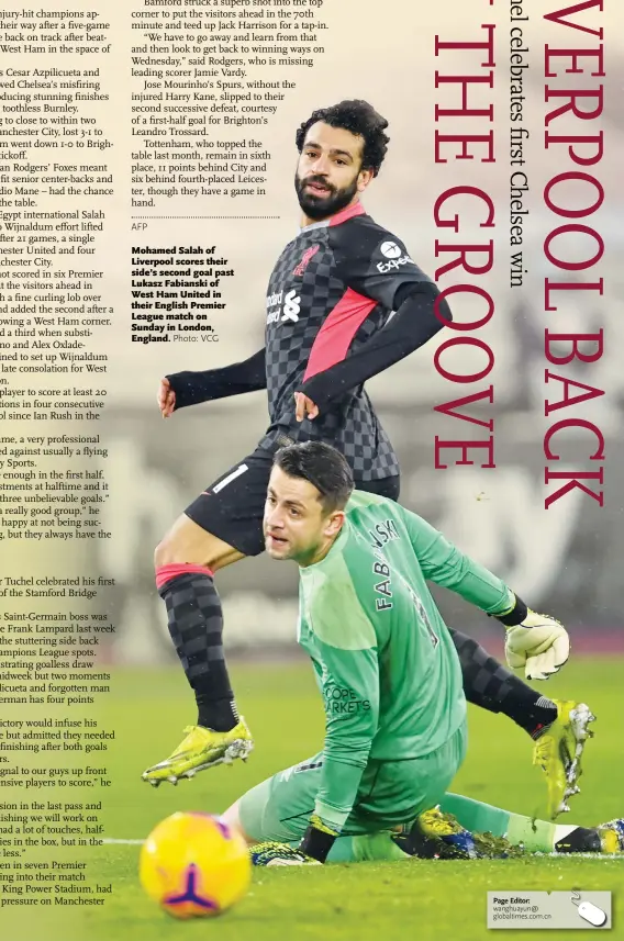  ?? Photo: VCG ?? Mohamed Salah of Liverpool scores their side’s second goal past Lukasz Fabianski of West Ham United in their English Premier League match on Sunday in London, England.