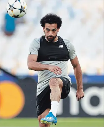  ?? MATTHIAS SCHRADER THE ASSOCIATED PRESS ?? Liverpool's Mohamed Salah poses a serious threat to the decade of dominance of the world player of the year award by Ronaldo and Barcelona’s Lionel Messi.