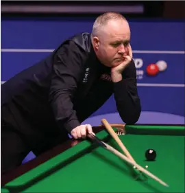  ??  ?? John Higgins reacts after missing a shot during his match against Mark Williams