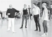  ??  ?? Choreograp­her Ronald Hynd, left, works with artists of Houston Ballet rehearsing “The Merry Widow.”