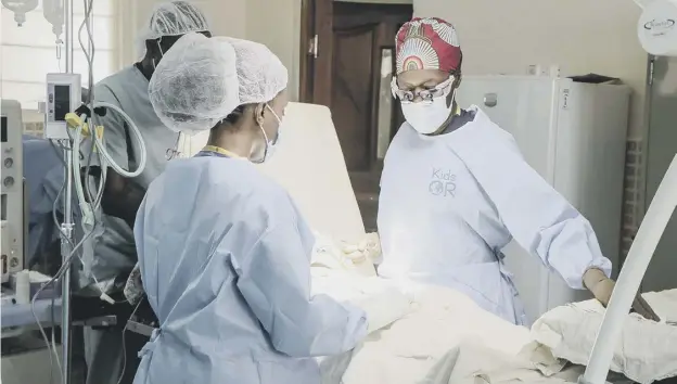  ?? ?? Dr Neema Kaseje and the surgical team in the Kids Operating Room at Kakuma refugee camp in Kenya, which has a population of about 185,000