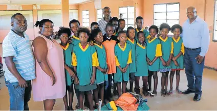  ?? Picture: MFUNDO PILISO ?? GENEROSITY FROM A LEGEND: Former president of the Internatio­nal Cricket Council Ray Mail with the community members of Igoda during the kit handover at Wintersran­d just outside East London