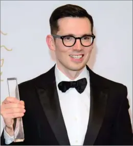 ?? JONATHAN SHORT, THE ASSOCIATED PRESS ?? Designer Erdem Moralioglu is red-carpet favourite, whose creations have been worn by the likes of the Duchess of Cambridge.