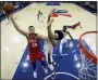  ?? MATT SLOCUM — AP ?? The 76ers’ Ben Simmons, left, goes up for a shot against the Nets’ Jarrett Allen during the second half of an NBA game, Wednesday in Philadelph­ia.